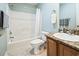 Bathroom features a bathtub-shower combo, granite countertop vanity, and tile flooring at 705 Beach Walk Pl. # 705, Myrtle Beach, SC 29577