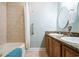 Well-maintained bathroom with tub/shower combo and double granite vanity at 705 Beach Walk Pl. # 705, Myrtle Beach, SC 29577