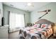 Cozy bedroom featuring a comfortable bed, bright window, and tasteful decor elements at 705 Beach Walk Pl. # 705, Myrtle Beach, SC 29577
