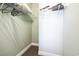 Spacious walk-in closet with metal racks for organized storage of clothes and other items at 705 Beach Walk Pl. # 705, Myrtle Beach, SC 29577