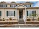 Charming exterior view of a townhouse with inviting entrance and well-maintained landscaping at 705 Beach Walk Pl. # 705, Myrtle Beach, SC 29577