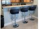 Stylish kitchen bar with granite countertop, comfortable seating, and modern design at 705 Beach Walk Pl. # 705, Myrtle Beach, SC 29577