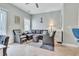 Comfortable living room with tile flooring, stylish furniture, and bright natural light from window at 705 Beach Walk Pl. # 705, Myrtle Beach, SC 29577