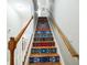 Unique stairway featuring a colorful patterned design and wooden handrails at 705 Beach Walk Pl. # 705, Myrtle Beach, SC 29577