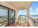Relaxing balcony with seating area and expansive ocean views at 707 S Ocean Blvd. # 304, North Myrtle Beach, SC 29582