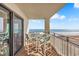 The condo balcony provides an expansive view of the beach at 707 S Ocean Blvd. # 304, North Myrtle Beach, SC 29582