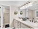 Bright bathroom with dual sinks, modern lighting, and decorative accents at 707 S Ocean Blvd. # 304, North Myrtle Beach, SC 29582