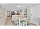 Bright dining room area with adjacent kitchen and coastal-themed decorations for a welcoming space at 707 S Ocean Blvd. # 304, North Myrtle Beach, SC 29582