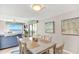 Dining area with table and chairs is conveniently located adjacent to the living room and balcony at 707 S Ocean Blvd. # 304, North Myrtle Beach, SC 29582