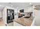 Well-lit kitchen featuring granite countertops, stainless steel appliances, and white cabinets at 707 S Ocean Blvd. # 304, North Myrtle Beach, SC 29582