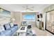 Cozy living area with plush seating, coastal decor, and an ocean view is perfect for relaxation at 707 S Ocean Blvd. # 304, North Myrtle Beach, SC 29582