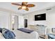 Spacious bedroom with coastal decor, ceiling fan, and ensuite bathroom access at 707 S Ocean Blvd. # 304, North Myrtle Beach, SC 29582