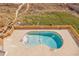 Aerial view of a kidney bean-shaped pool with ocean views in the background at 707 S Ocean Blvd. # 304, North Myrtle Beach, SC 29582