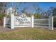 Entrance sign for South Marsh, set against a backdrop of lush green lawn and trees at 728 Elizabeth Dr., Murrells Inlet, SC 29576