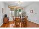 Charming dining area with a large window and a classic wooden dining set at 728 Elizabeth Dr., Murrells Inlet, SC 29576