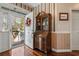 Elegant foyer featuring a wooden secretary desk and a view of the front porch at 728 Elizabeth Dr., Murrells Inlet, SC 29576