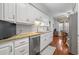 Modern kitchen featuring white cabinets, granite countertops, and stainless steel appliances at 728 Elizabeth Dr., Murrells Inlet, SC 29576