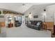Bright living room with large windows, neutral carpet, and comfortable seating at 728 Elizabeth Dr., Murrells Inlet, SC 29576