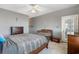 Spacious main bedroom with ceiling fan, and ensuite bathroom at 728 Elizabeth Dr., Murrells Inlet, SC 29576