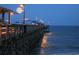 Moonlit pier over ocean waters, with lights and an observation deck at 728 Elizabeth Dr., Murrells Inlet, SC 29576