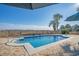 Sparkling pool with palm trees, metal fencing, and unobstructed views of a marsh at 728 Elizabeth Dr., Murrells Inlet, SC 29576