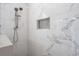 Tiled shower features a rainfall shower head and tiled niche at 728 Elizabeth Dr., Murrells Inlet, SC 29576