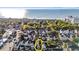 Aerial view showcasing a charming coastal neighborhood with the ocean visible in the background at 7809 Monarch Dr., Myrtle Beach, SC 29572