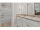 Bathroom features a double sink vanity with granite countertop and tiled floor with a shower/tub at 7809 Monarch Dr., Myrtle Beach, SC 29572