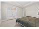 Bedroom boasts tray ceilings, access to a private balcony, and neutral carpet at 7809 Monarch Dr., Myrtle Beach, SC 29572