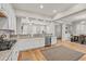 Open-concept kitchen showcasing granite counters, a breakfast bar, and stainless steel appliances at 7809 Monarch Dr., Myrtle Beach, SC 29572