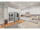 Modern kitchen featuring stainless steel appliances, white cabinets, and granite countertops at 7809 Monarch Dr., Myrtle Beach, SC 29572