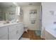 Well-lit bathroom with double vanity, updated cabinetry, and a separate shower and tub at 793 Drawbridge Dr., Conway, SC 29526