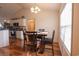 Cozy dining area featuring hardwood floors and natural light, perfect for enjoying meals at 793 Drawbridge Dr., Conway, SC 29526