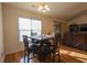 Cozy dining room adjacent to the living area features hardwood floors and a view of the backyard at 793 Drawbridge Dr., Conway, SC 29526