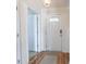 Welcoming hallway featuring hardwood floors, a front door, and access to other rooms at 793 Drawbridge Dr., Conway, SC 29526