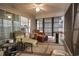 Bright sunroom with ample seating and natural light, ideal for enjoying outdoors at 793 Drawbridge Dr., Conway, SC 29526