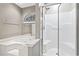 Bathroom featuring a jacuzzi tub with window and glass enclosed shower at 810 Finger Lake Dr., Myrtle Beach, SC 29588