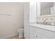 Bathroom featuring a white vanity with a marble countertop and a storage cabinet at 810 Finger Lake Dr., Myrtle Beach, SC 29588