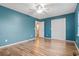 Bedroom featuring hardwood floors, a ceiling fan, and access to the bathroom at 810 Finger Lake Dr., Myrtle Beach, SC 29588