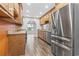 Well-lit kitchen featuring wood cabinets, stainless steel appliances, and wood-look flooring at 810 Finger Lake Dr., Myrtle Beach, SC 29588