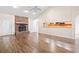 Bright and spacious living room with brick fireplace and hardwood flooring at 810 Finger Lake Dr., Myrtle Beach, SC 29588
