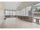 Bright sunroom with many windows and a ceiling fan at 810 Finger Lake Dr., Myrtle Beach, SC 29588