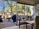 Relaxing back porch with comfortable seating, grill, and serene views of the backyard at 820 9Th Ave. S, North Myrtle Beach, SC 29582