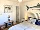 Nautical themed bedroom with pelican and shark decor, white furniture, and bright natural light at 820 9Th Ave. S, North Myrtle Beach, SC 29582