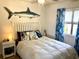 Serene bedroom with a queen-sized bed, coastal decor, and natural light from the window at 820 9Th Ave. S, North Myrtle Beach, SC 29582