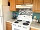 Bright kitchen with white appliances, light wood cabinets, and modern backsplash at 820 9Th Ave. S, North Myrtle Beach, SC 29582