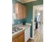 The kitchen features wood cabinets and countertops with an opening view into the living room at 820 9Th Ave. S, North Myrtle Beach, SC 29582