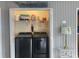 Laundry room with modern washer/dryer and wire shelving for storage at 820 9Th Ave. S, North Myrtle Beach, SC 29582