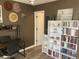 Open-concept office with bookshelves, pelican art, and natural light at 820 9Th Ave. S, North Myrtle Beach, SC 29582
