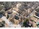 Aerial shot showcases the home's setting amongst mature trees and road frontage at 822 Highway 90, Conway, SC 29526